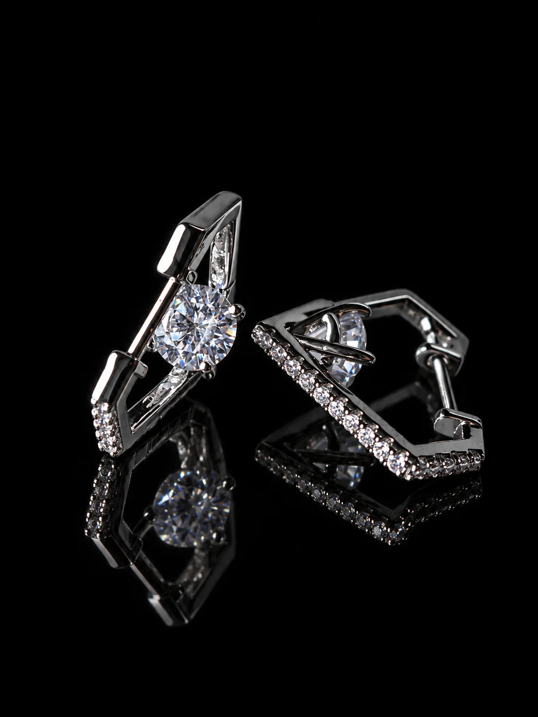 Silver Marquise Halo Huggies on a black background