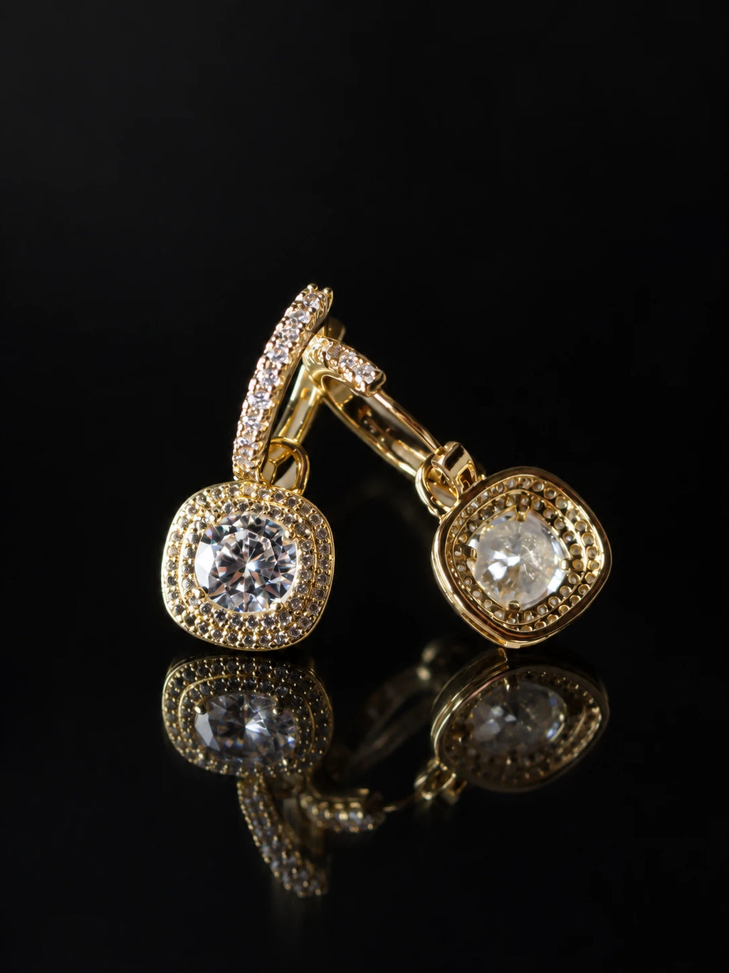Gold Cushion Halo Drop Hoops on a black background