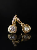 Gold Cushion Halo Drop Hoops on a black background