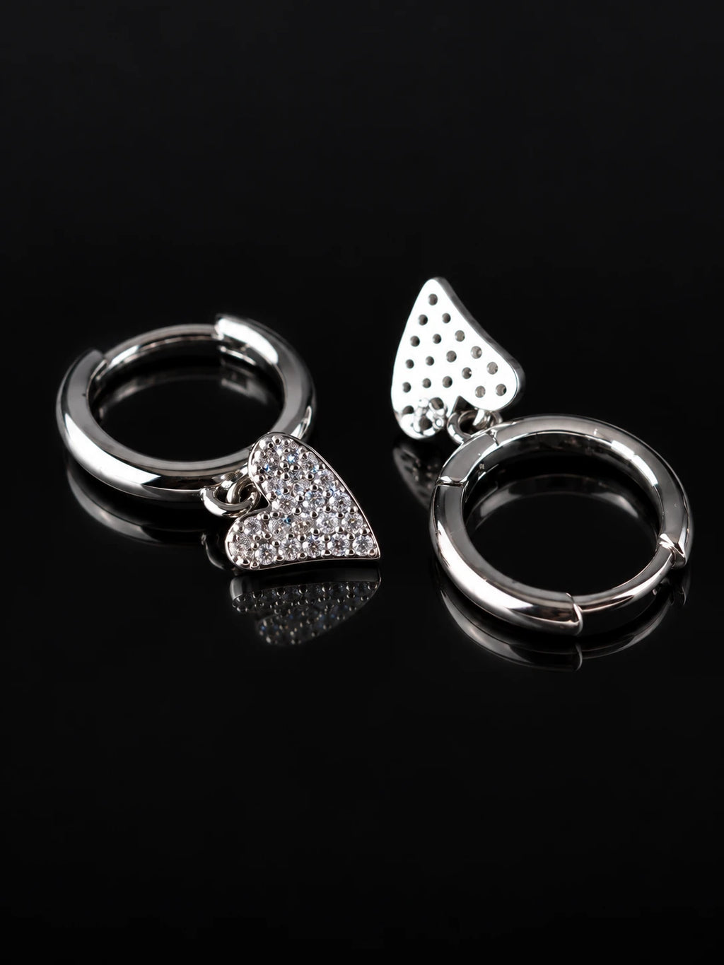 Silver Heart Charm Hoops on a black background