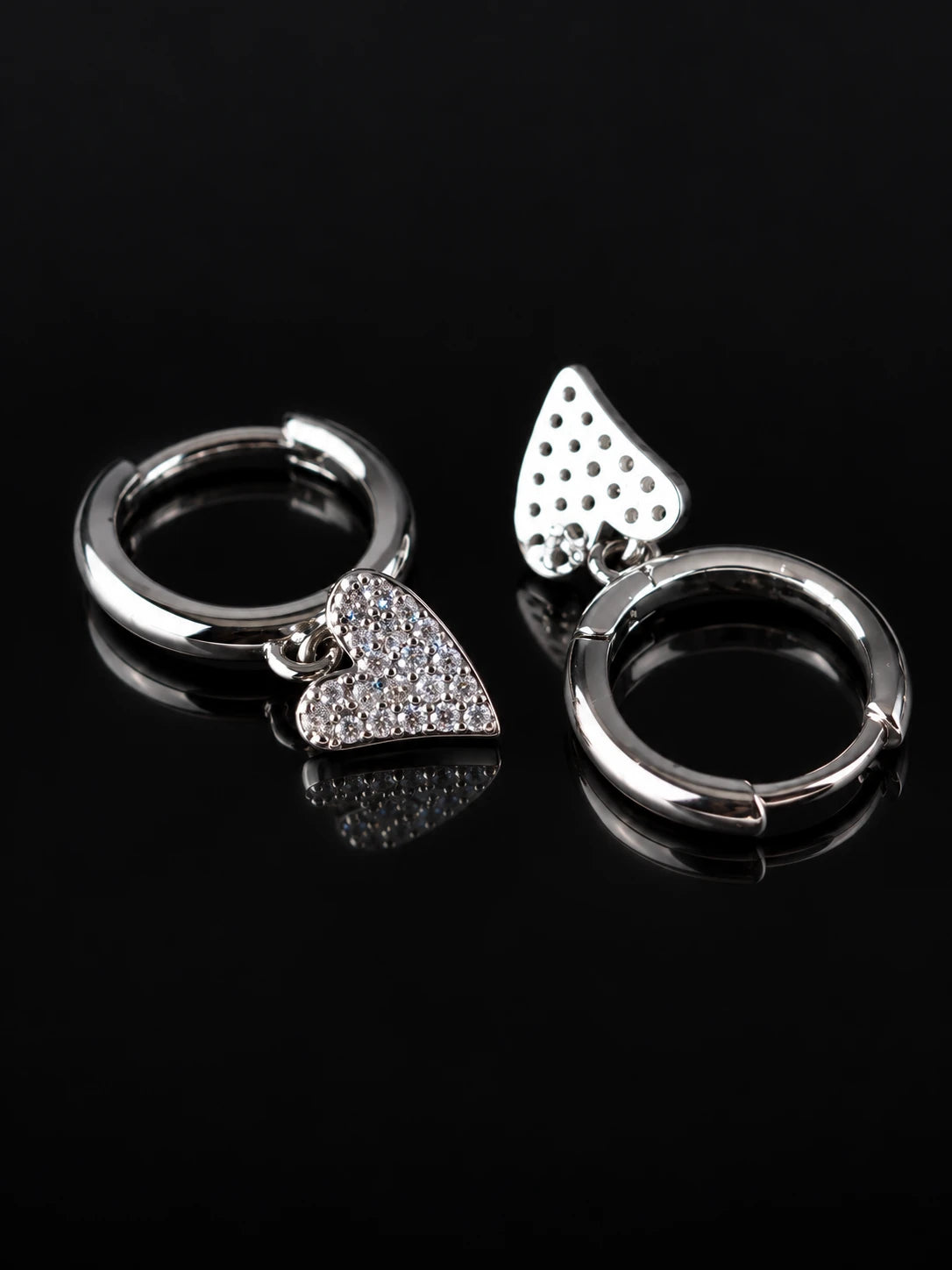 Silver Heart Charm Hoops on a black background