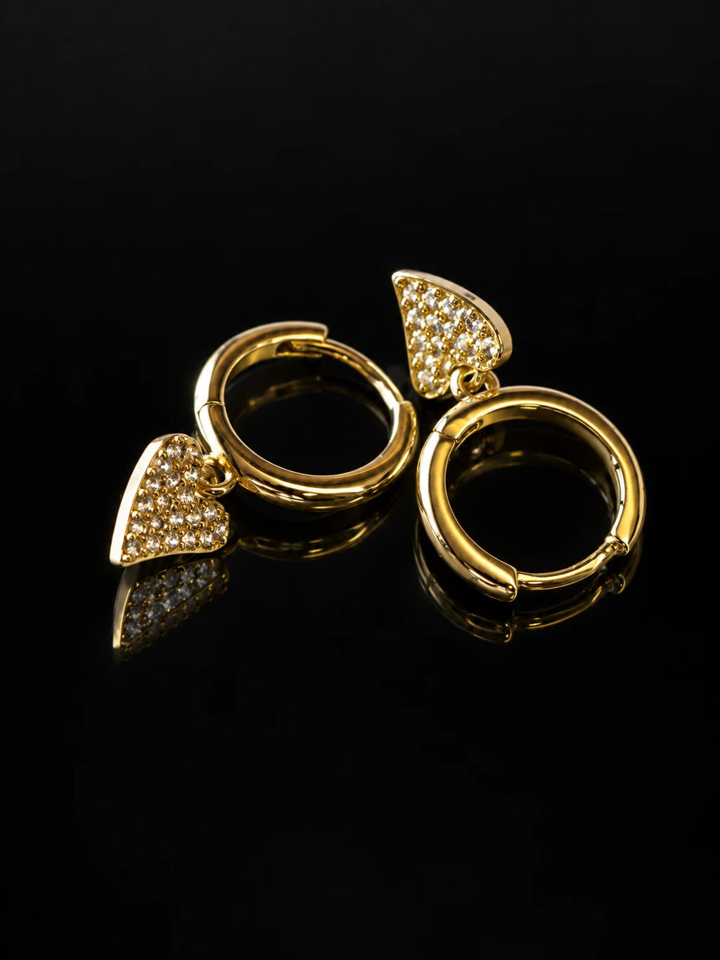 Gold Heart Charm Hoops on a black background