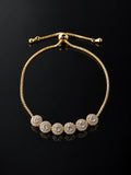 Gold Pavé U-Cuff Bracelet on a black background
