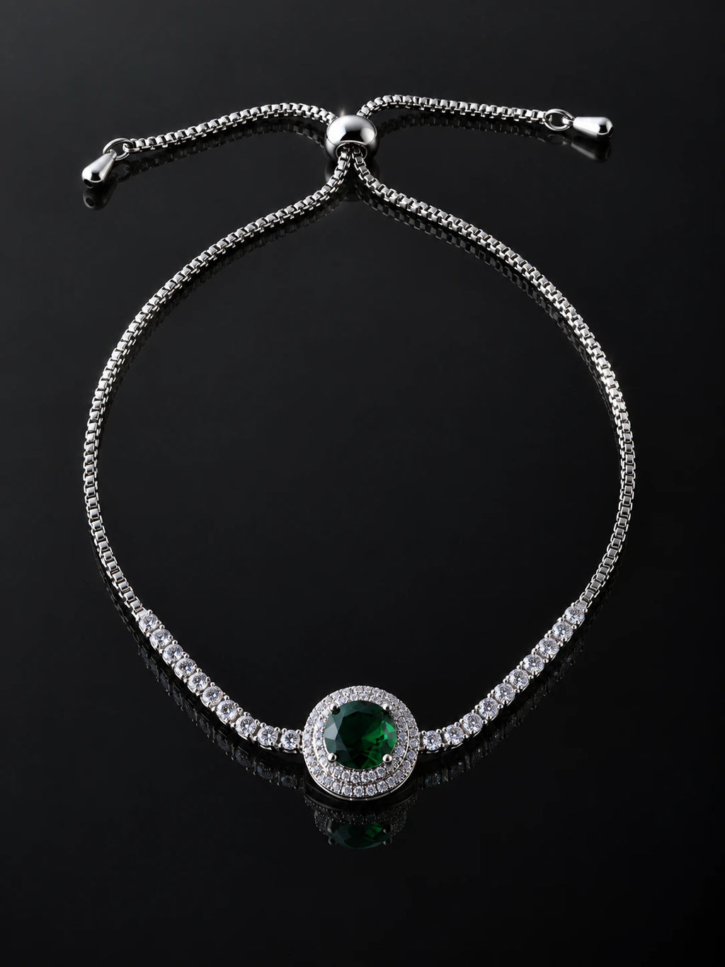 Green Solitaire Pavé Bracelet on a black background
