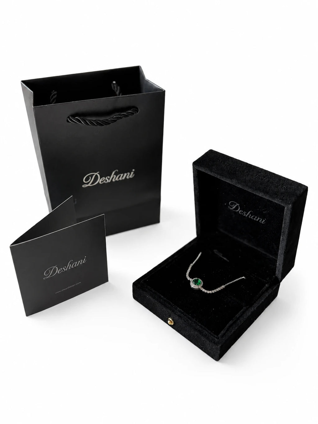 Side view of Green Solitaire Pavé Bracelet on a white background