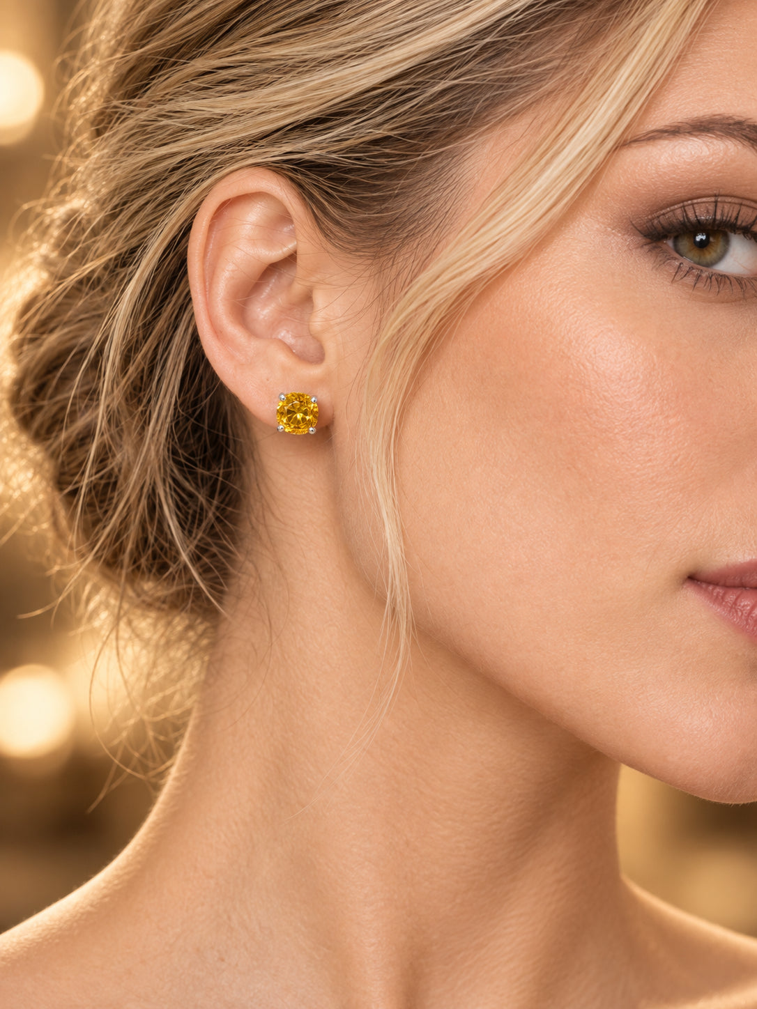 Close-up of Golden CZ Stud Earrings being worn