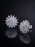 Starburst Flower Clip-On Earrings on a black background