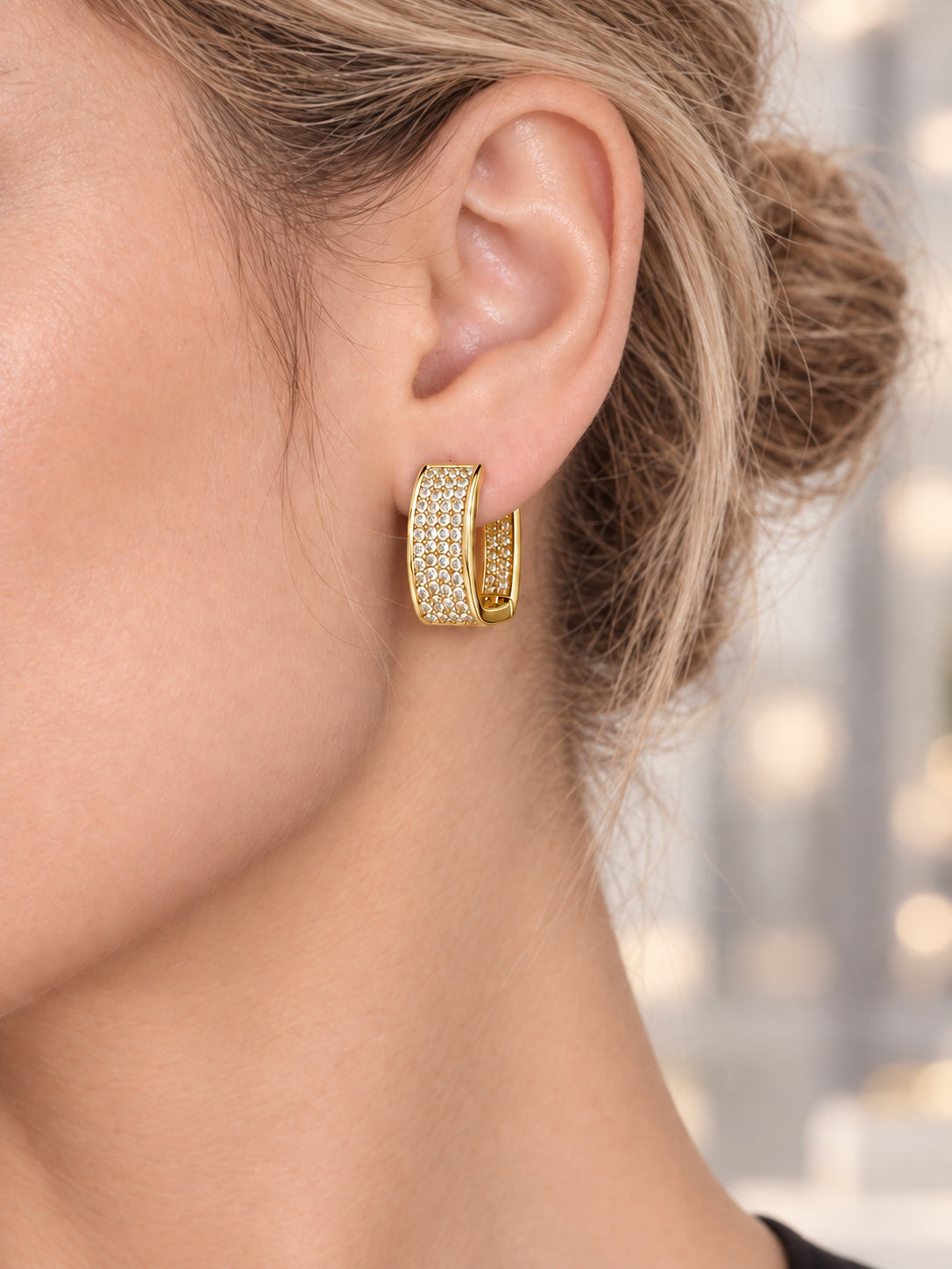 Close-up of Gold Pavé Square Earrings being worn