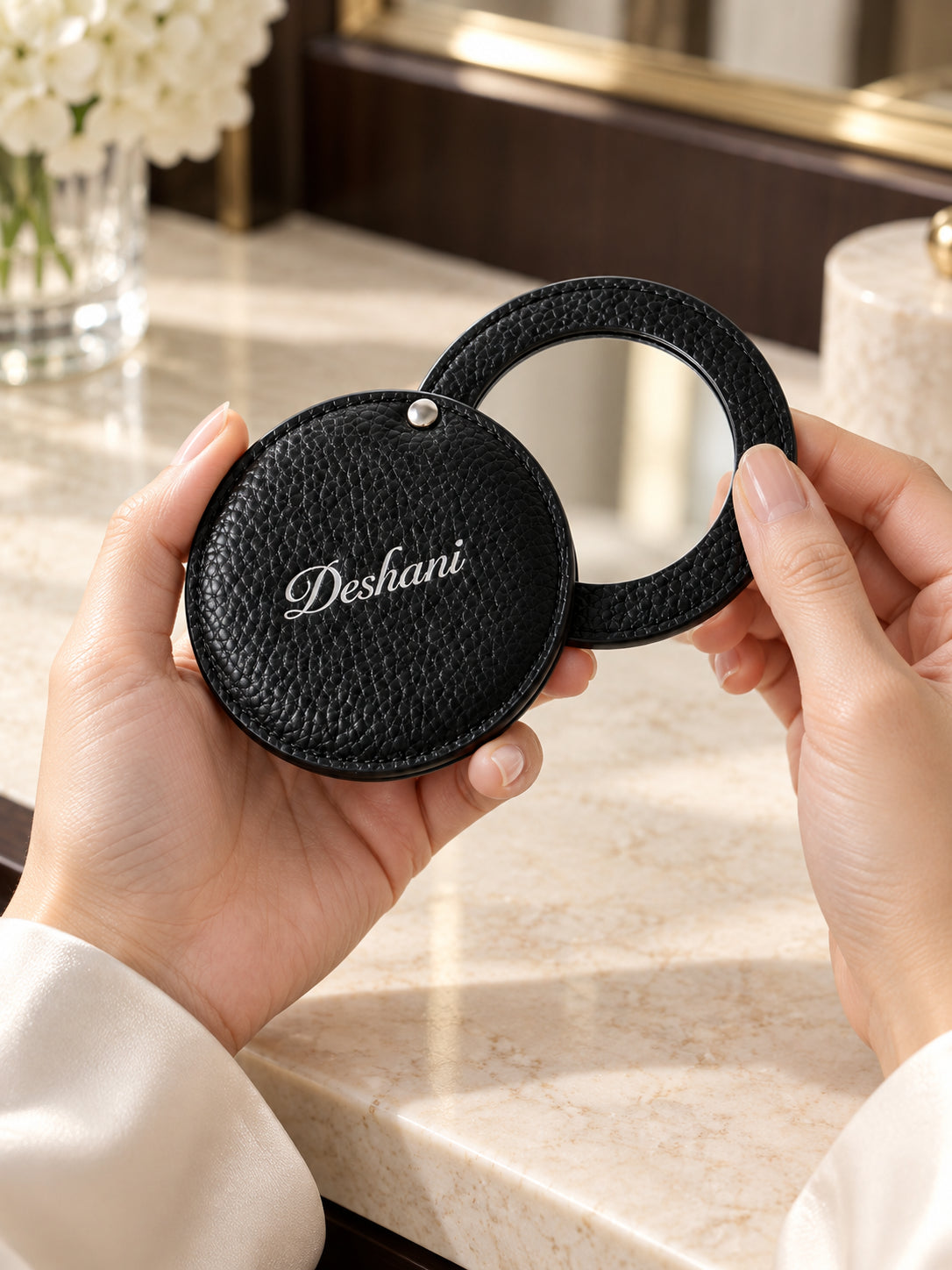 Close-up of Deshani Compact Leather Mirror in use