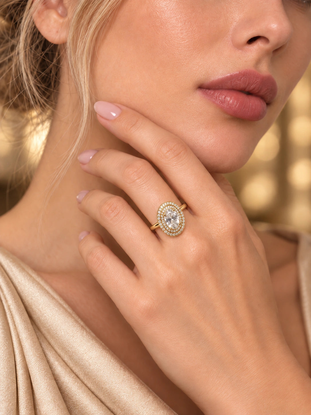 Close-up of Gold Oval Double Halo Ring being worn