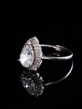 Pear-Cut Double Halo Open Ring on a black background