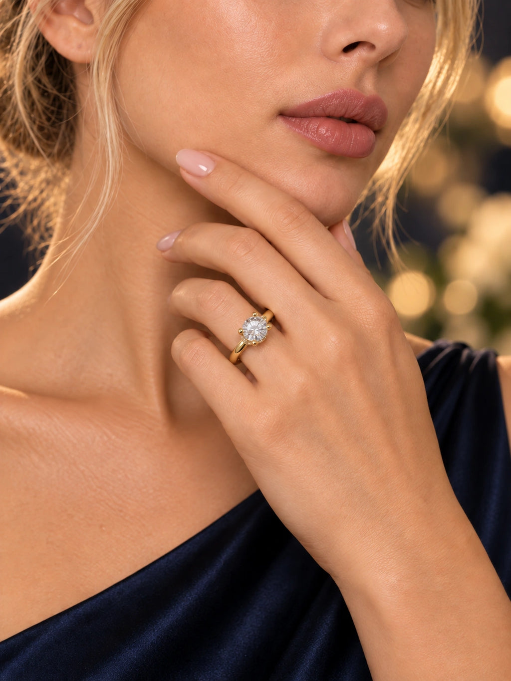 Close-up of Gold Round CZ Solitaire Ring being worn